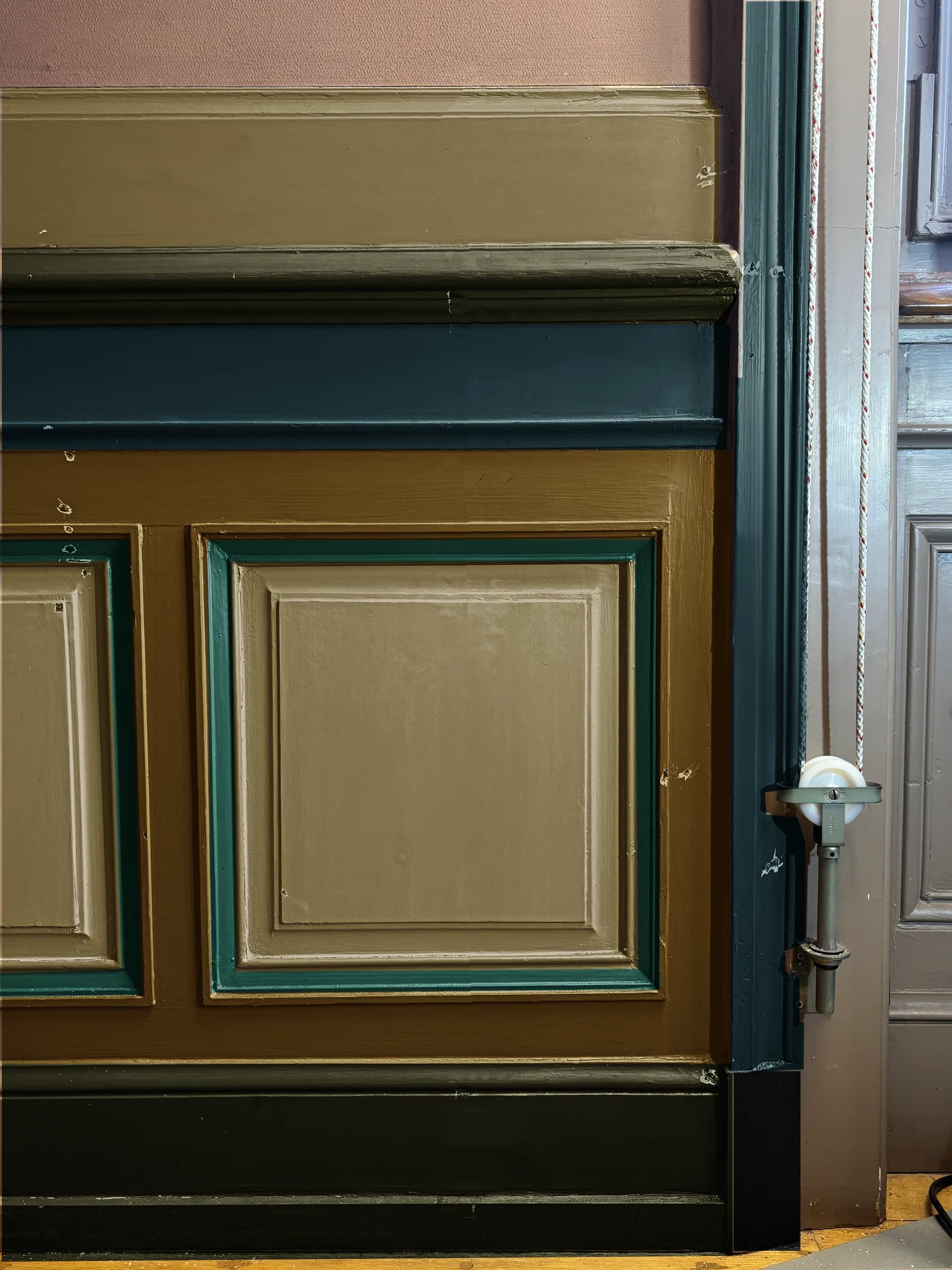 Digital colour interpretation of the same woodwork, with khaki, deep blue, dark green and emerald areas following the investigation map.